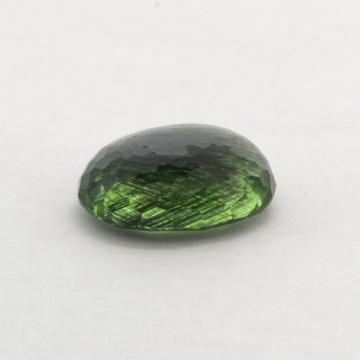 Show details for Tourmalated Peridot Oval Faceted Gemstone 24.8ct. 21x16mm Tourmalated Peridot Gemstone 24.8ct. 21x16mm Oval