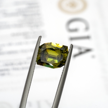 Show details for Color Change Demantoid Garnet Gemstone 3.96ct W/ GIA Report GIA Report 2215833197 3.96 carat Andradite Color Change Demantoid Rhomboid Loose Gemstone Sku G1410955P Crown Closeup